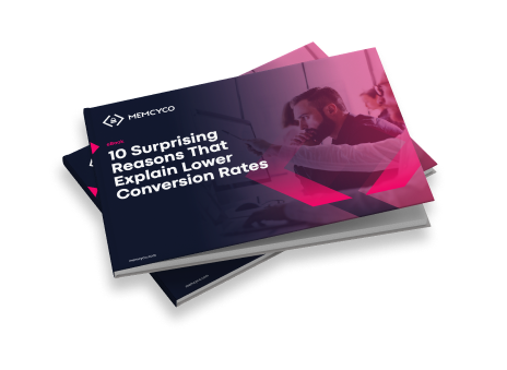 A single E-book titled "10 Surprising Reasons That Explain Lower Conversion Rates" by Memcyco is shown on top of another booklet against a white background.